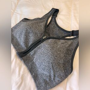 Large gray DSG front zipper sports bra with adjustable straps and removable cups